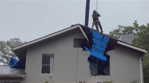 Crews work to remove tree from Decatur home