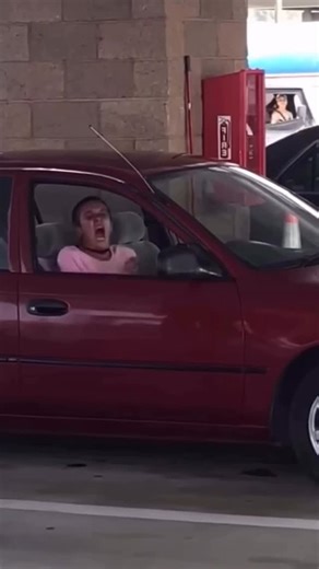Viral News 🔥 on Instagram: "🚨 What is going on here!? 😳 A woman sitting in her car at a gas station suddenly starts screaming “GET AWAY FROM ME!” — and then her voice shifts into this wild, robotic, glitchy-sounding tone that nobody around her could even process. People nearby froze… Some thought it was fear, some thought it was a panic attack, others said it sounded like pure exhaustion and stress hitting its breaking point. Whatever this was, it’s a reminder that you never really know what 