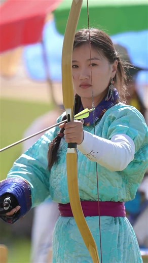 Mongolian girl traditional archery