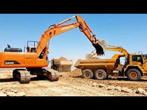 Heavy Machinery Excavators Loading Dump Trucks
