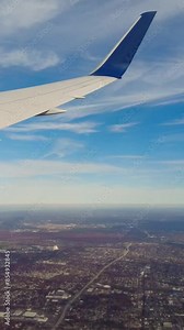 Plane turning banking flying over long island on arrival into new york john f kennedy airport usa