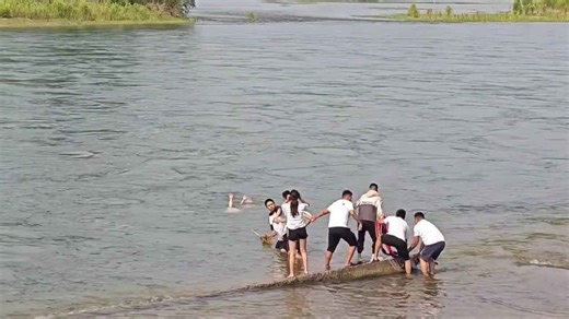 Dramatic moment swimmer rescues drowning mother and child