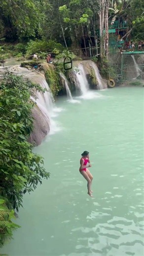 Would you dare to swing into this turquoise waterfall? 🌊
