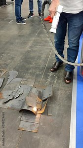 Laser metal cleaning. Several sheets of metal and laser beam cleans surface of the metal from rust and dirt. New modern innovation technologies. Machinery instrument cleaning metal industry Vertical