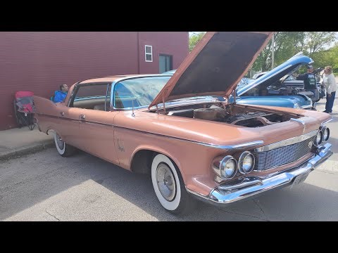 A 1960 Chrysler Imperial is leaving the Odell Car Show in Odell, Illinois.