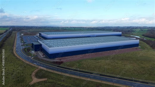 Aerial view of huge new build distribution centres, ombre cladding design, massive logistics and transport hub for import export manufacturing production businesses in Magna Park, UK