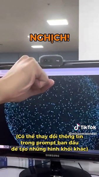 Tạo hệ thống hạt 3D tương tác thời gian thực với Three.js. Yêu cầu: 1.Điều khiển việc thu phóng và mở rộng nhóm hạt bằng cách phát hiện chuyển động căng và khép của cả hai bàn tay thông qua camera. 2. Ở trạng thái thu gọn, các hạt xếp thành hình cầu 3. Hỗ trợ bộ chọn màu để điều chỉnh màu sắc của các hạt. 4. Các hạt cần phản hồi theo thời gian thực với các thay đổi cử chỉ tay. 5. Giao diện đơn giản và hiện đại. 6. Đặt tất cả vào trong 1 file html. #gemini #aiart #learnontiktok #3dart #oneai