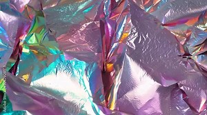 A vibrant display of colorful reflective foil exhibits a stunning iridescent effect, perfect for enhancing creative artwork and presentations. The shimmering surface attracts the eye.