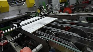 Automated production line in a factory producing ceramic tiles and porcelain stoneware. Factories And Industry Concept.