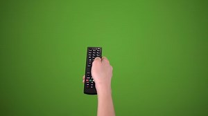 clip-1056668942-hand-using-remote-control-over-green-screen