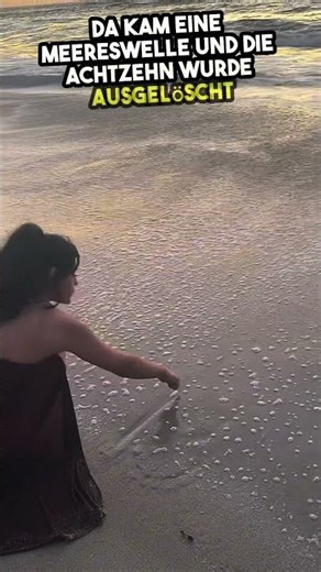 Alone on the beach, she writes 19 in the sand