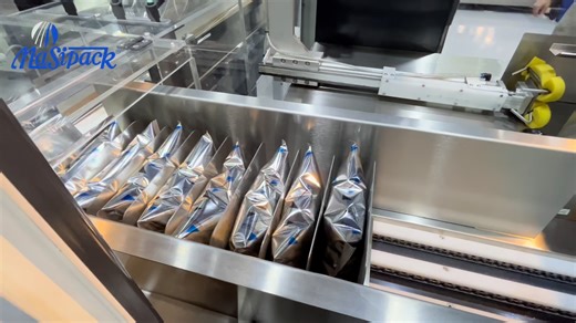 There’s nothing quite like the sound of packaging done right. 🎶 Watch two vertical baggers feed a baling machine that groups bags into a durable exterior plastic package—replacing the need for cardboard boxes. | Masipack