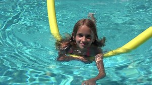 Child Swimming in Pool, Smiling Kid, Girl Portrait Enjoying Summer Vacation