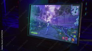 Enjoying the newest computer video game on the modern pc. Using the female cartoon character in the shooter computer video game. Dying to the enemy shot in the online competitive computer video game. Stock Video