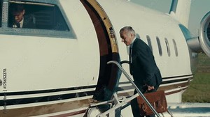 VIP Businessman or public figure boarding private jet & waving