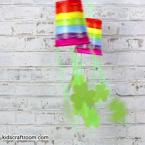 These Rainbow and Shamrock Windsocks are so colourful and fun. A lovely St Patrick's Day craft for kids. https://kidscraftroom.com/paper-cup-st-patricks-day-windsock-craft/ | Kids Craft Room