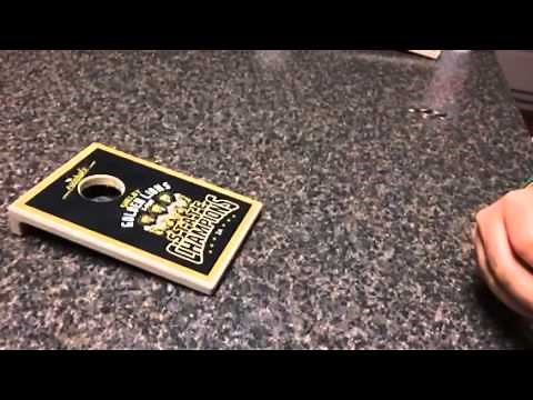 How to bounce a quarter for Coinhole in slow motion. coin hole