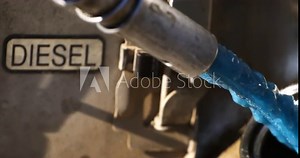 Super slow motion of liquid diesel fuel is flowing from tank to fill can at plant industrial factory at 1000 fps.