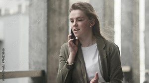 Irritated arguing young businesswoman yelling at mobile phone at city centre Angry nervous female talk on smartphone expressing negative emotion outdoors Bad conflict working or personal conversation