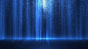 The blue light from the dust creates beautiful bokeh. elegant abstract background video with light