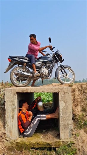 The red motorcycle makes noise.