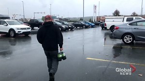 People wait in line to stock up for hurricane Teddy