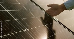 Connection and mounting of solar panels. worker fasten solar panels. Technician connecting solar panel. Technician working with electrical screwdriver installing solar panel to metal platform system.