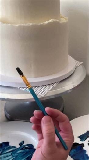 Hand painting mountains with food coloring