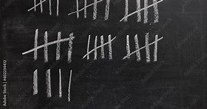 Drawing counting tally chart with chalk, marks in groups of five, appearing fast stop motion style
