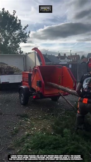 Chipping tree branches fast with wood chipper