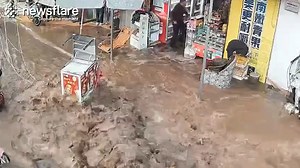 Massive water pressure was released into the street and local businesses when an underground pipe burst 👇 | Newsflare