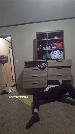 Man tries to bench press dresser and TV stand
