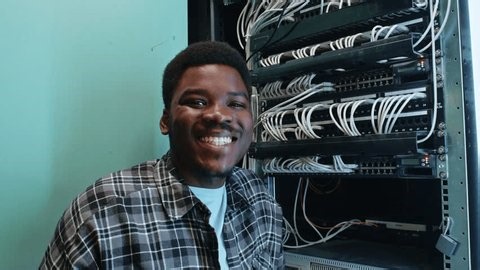 clip-3996160323-young-man-works-on-computer-network-tech