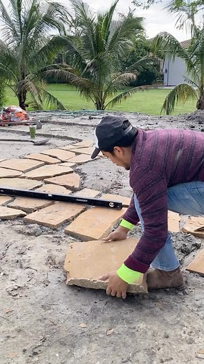 Flagstone path in the courtyard… -We used a flagstone from Arizona -Hand select flagstone for desired shapes -3” to 5” wide spacing between -set stone in a wet mortar mix -level the flagstone -remove mortar from the joint spaces and -plant creeping ground cover plants in the joints | Matthew Giampietro Garden Design