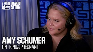 “He’s very hands-on.” Amy Schumer talks working with Adam Sandler on her new Netflix movie, “Kinda Pregnant.” | The Howard Stern Show