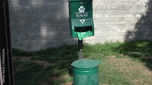 Dog waste receptacle. Environmental friendly free animal poop bag.