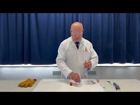 'Drilling' a hole in a rubber bung