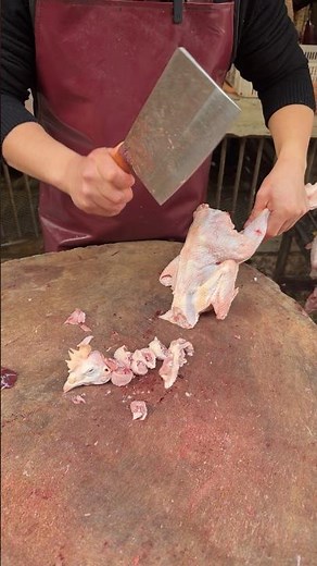 Fast Cutting Skills of Chinese man chopping a Chicken