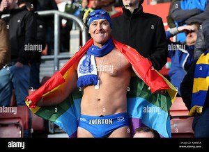 Michael Cullen aka Speedo Mick wearing a rainbow flag in support of the 'Stonewall' Rainbow Laces campaign for LGBT inclusion in the stands during the Premier League match at St Mary's, Southampton Stock Photo - Alamy