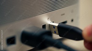 Close-up of USB ports in a computer with a metal case many different connectors inserted Type- wires connector designators female hand inserts Type-