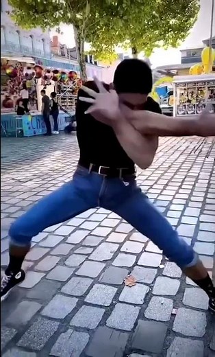 guy hits punching bag and screams