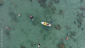 Drone view rowing SUP on Hon Chong beach, Nha Trang city, Khanh Hoa province, central Vietnam