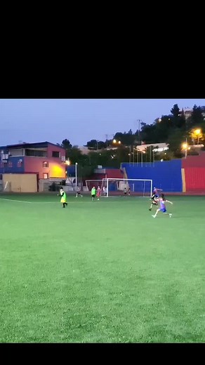 Kids Enjoying Evening Soccer Match on Outdoor Field