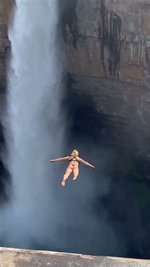 She Jumped Into Deep Blue Water Beside a MASSIVE Waterfall! 😱🌊 This Is INSANE! #Shorts
