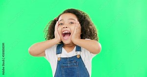Shocked, surprise and child hands on face screaming and excited, happy and winning isolated in a studio green screen background. Portrait, young and kid with surprised facial expression due to news