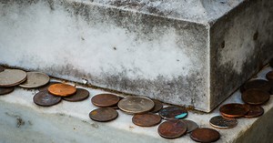 If you find a coin on a loved one's gravestone, you had better know what it means