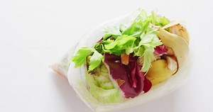 Overhead video of organic fruit and vegetable waste in bag for composting, with copy space. Ecology, recycling, care and nature concept.