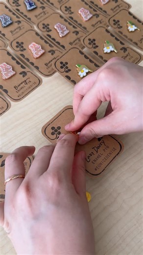 Eunice Chiong on Instagram: "Giving my enamel pin backing cards a hand-stamped touch! ✨ Using the: @prixelpress DIY Stamp Kit @rokr_official DIY Printing Press #enamelpins #rubberstamp #stampart #prixel #rokr"