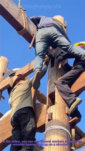 Traditional Timber Framing: Workers Assemble on Beams