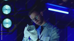 Professional scientists in white coats working inside modern futuristic laboratory . Construction experts doing experiment . Physician or seismologist testing inside lab . Concept of quality checking